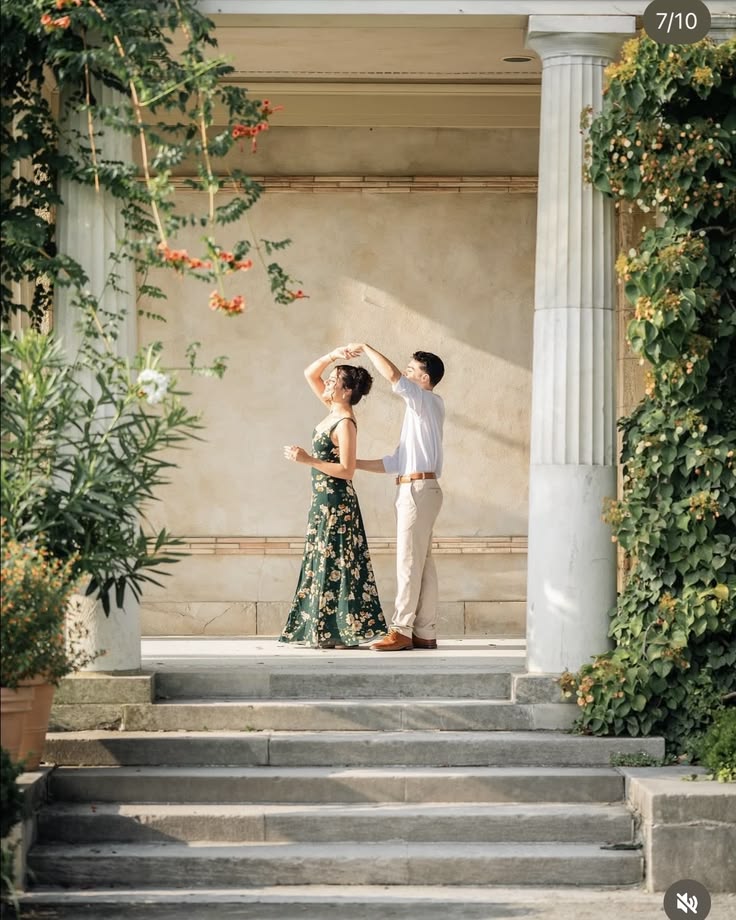 a man and woman dancing on the steps